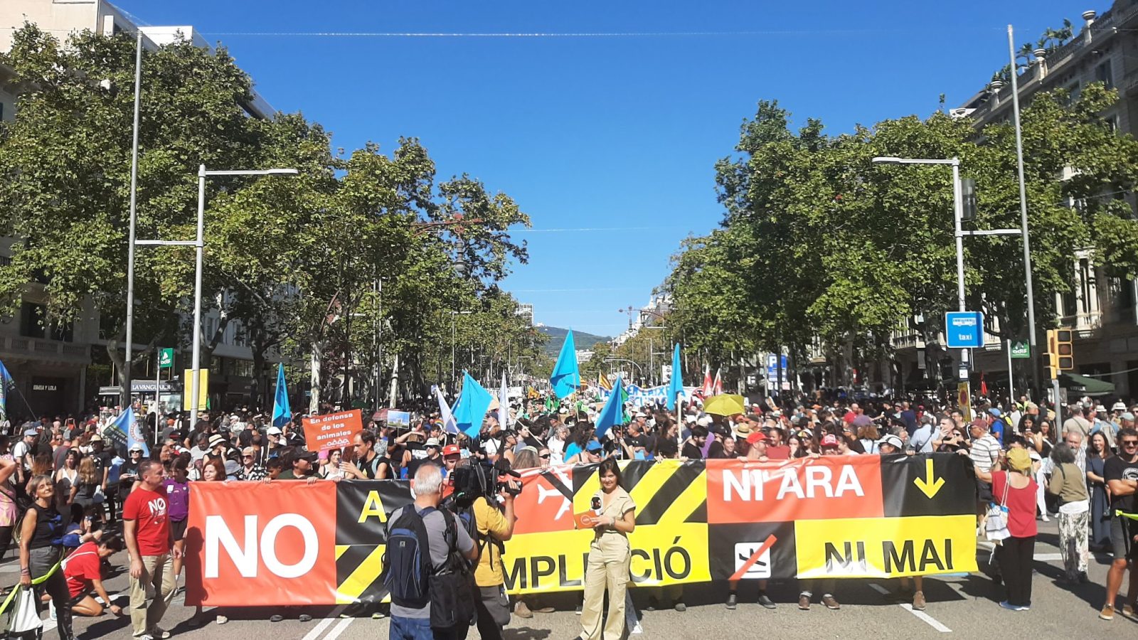Protesters march through Barcelona against the El Prat airport expansion.