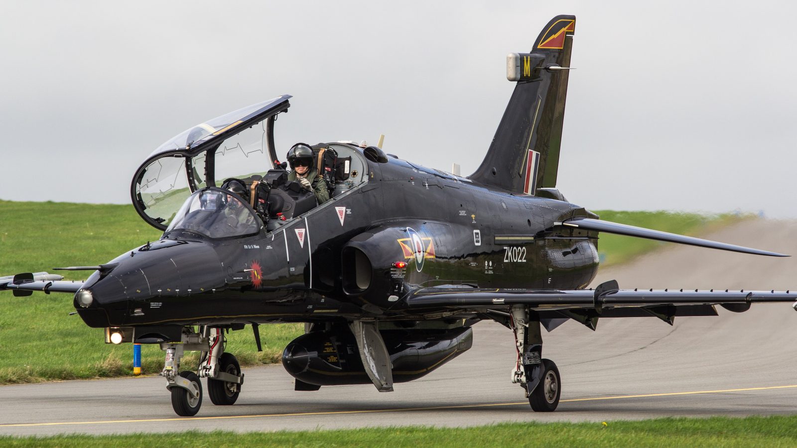 Two pilots ejected safely before an RAF Hawk T2 crashed near RAF Valley on Anglesey. Both are being treated for minor injuries as an investigation begins.