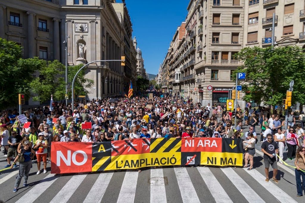 Protesters march through Barcelona against the El Prat airport expansion