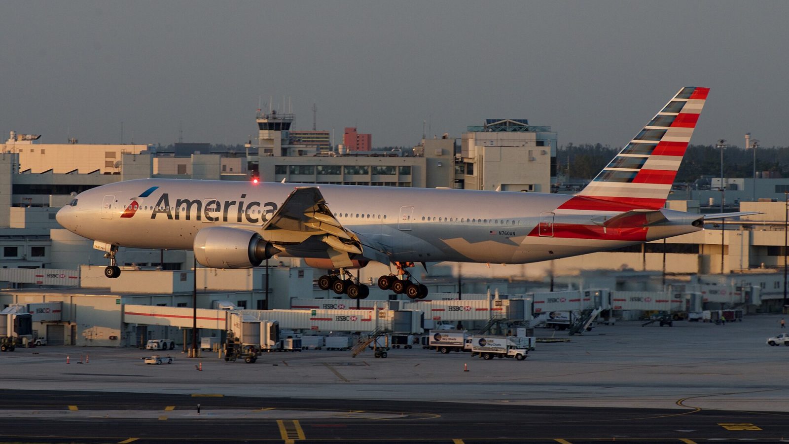 American Airlines fleet: American 777 showing some strobe over an empty concourse, MIA