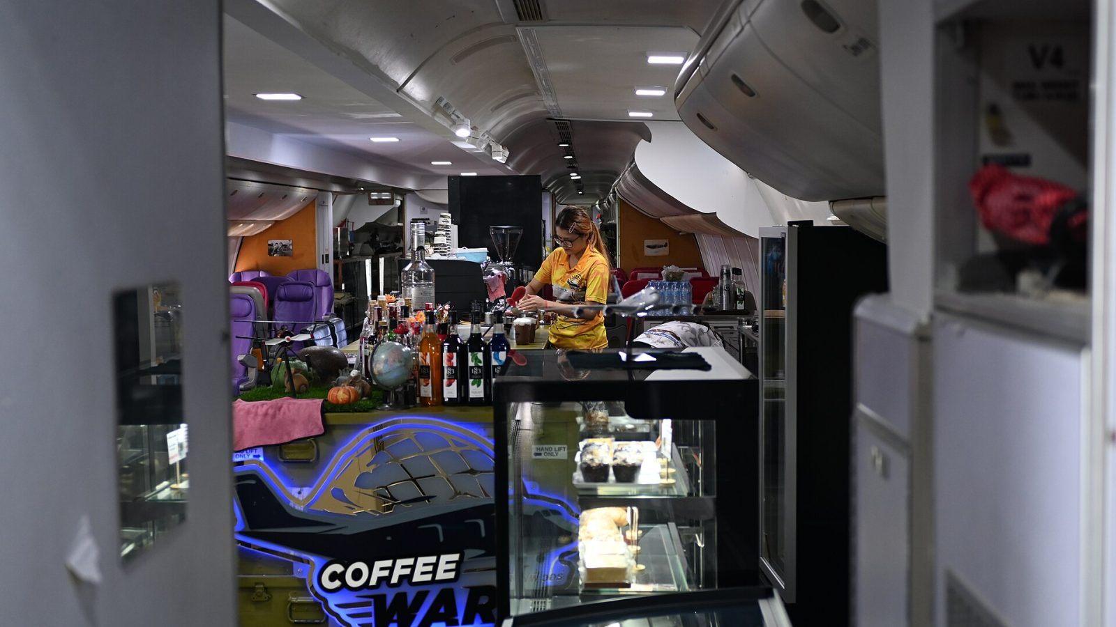 leave your seat: This photograph captures the interior of a creatively repurposed airplane that has been converted into a coffe