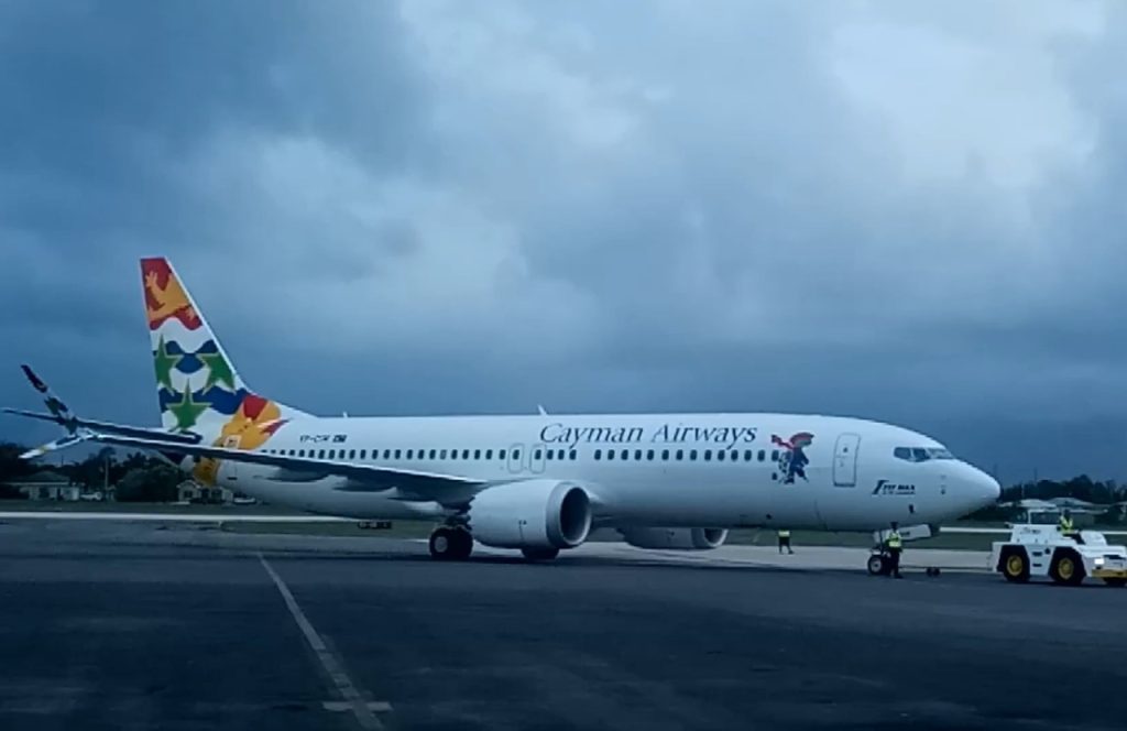 The 1st Cayman Airways 7373 MAX 8 Reg. Tail # VP-CIW being towed to Cayman Airways Hanger at Owen Roberts Inte